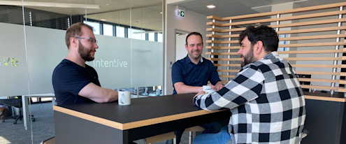 Three employees at one conference table Three employees at one conference table
